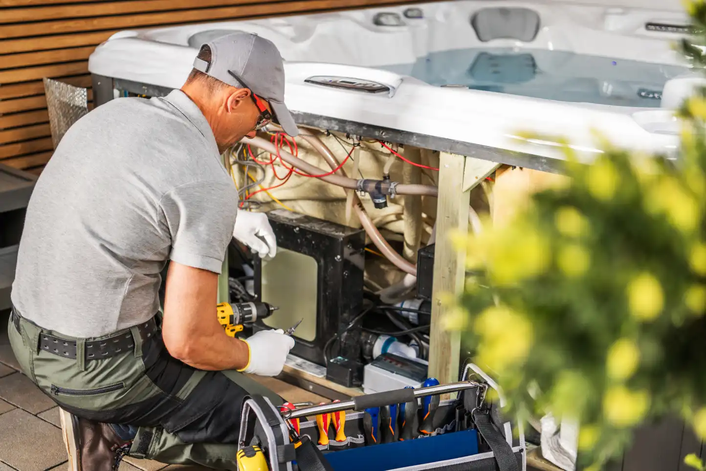 Repairing a hot tub in a backyard. Call or contact Mr. Bright Electric for professional electrical services in Clark and Cowlitz counties.